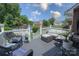 Outdoor deck with cushioned seating area overlooking a fenced in pool at 150 Wordsworth Way, Mooresville, NC 28115
