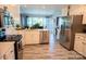 Bright kitchen features stainless appliances, stylish flooring, and ample counter space at 150 Wordsworth Way, Mooresville, NC 28115