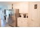 Bright kitchen features stainless appliances and ample white cabinet space at 150 Wordsworth Way, Mooresville, NC 28115