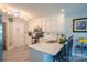 Well-lit kitchen with a breakfast bar, stainless steel appliances and stylish flooring at 150 Wordsworth Way, Mooresville, NC 28115