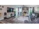 Open living room with wood flooring, a fireplace, and modern decor at 150 Wordsworth Way, Mooresville, NC 28115