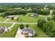 Sprawling property featuring a house with a pool and a spacious lawn surrounded by mature trees at 1533 Ohara Plantation Ct, Dallas, NC 28034