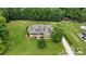 Expansive property showcasing a well-manicured lawn and beautiful home with a long driveway at 1533 Ohara Plantation Ct, Dallas, NC 28034
