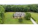 Expansive property showcasing a well-manicured lawn, mature trees, and beautiful home exterior at 1533 Ohara Plantation Ct, Dallas, NC 28034