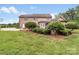 Well-manicured backyard with an outdoor pergola and lush greenery at 1533 Ohara Plantation Ct, Dallas, NC 28034