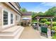 Outdoor patio with pergola, seating area, and manicured landscaping at 1533 Ohara Plantation Ct, Dallas, NC 28034