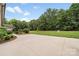 Large backyard with a beautifully maintained lawn and mature trees at 1533 Ohara Plantation Ct, Dallas, NC 28034