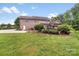 Expansive backyard featuring a pergola and mature trees, perfect for outdoor enjoyment at 1533 Ohara Plantation Ct, Dallas, NC 28034