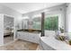 Comfortable primary bathroom with soaking tub, dual vanity, and view of the bedroom at 1533 Ohara Plantation Ct, Dallas, NC 28034