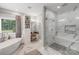 Bright bathroom boasts double sinks, a standalone tub, and a walk-in shower at 1533 Ohara Plantation Ct, Dallas, NC 28034