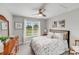 Inviting bedroom with a floral patterned bed, decorative accents, and a bright window offering peaceful views at 1533 Ohara Plantation Ct, Dallas, NC 28034