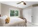 Bedroom with a large window, closet and neutral walls at 1533 Ohara Plantation Ct, Dallas, NC 28034