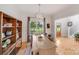 Bright dining room with large window, hardwood floors, and stylish light fixture at 1533 Ohara Plantation Ct, Dallas, NC 28034
