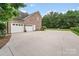 Spacious driveway leading to a three-car garage, perfect for ample parking at 1533 Ohara Plantation Ct, Dallas, NC 28034