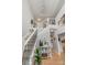 Elegant foyer featuring a staircase, hardwood floors, and stylish decor creating a grand entrance at 1533 Ohara Plantation Ct, Dallas, NC 28034