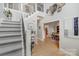 Inviting foyer with stairs, hardwood floors, and views into adjacent rooms enhancing the home's appeal at 1533 Ohara Plantation Ct, Dallas, NC 28034