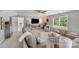 Inviting living room featuring a large sectional, entertainment center, and a bright window overlooking the outdoor view at 1533 Ohara Plantation Ct, Dallas, NC 28034