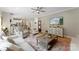 Open-concept living room with hardwood floors and kitchen view, perfect for entertaining at 1533 Ohara Plantation Ct, Dallas, NC 28034