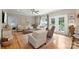 Bright living room with hardwood floors, neutral furniture, and access to the outdoor space at 1533 Ohara Plantation Ct, Dallas, NC 28034