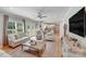 Spacious living room with neutral decor, hardwood floors, and open layout at 1533 Ohara Plantation Ct, Dallas, NC 28034