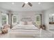 Bright main bedroom features a ceiling fan, windows, and a light color scheme at 1533 Ohara Plantation Ct, Dallas, NC 28034