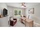 Well-lit home office featuring a modern desk, comfortable chair, and natural light, ideal for productivity and focus at 1533 Ohara Plantation Ct, Dallas, NC 28034