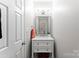 Well-lit powder room with updated vanity and fixtures at 1533 Ohara Plantation Ct, Dallas, NC 28034