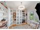 Spacious walk-in closet with custom shelving for shoes and a large window at 1533 Ohara Plantation Ct, Dallas, NC 28034