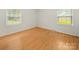 Bright and airy bedroom with hardwood floors and large windows at 1830 Huntington Pl, Rock Hill, SC 29732
