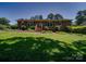 Charming brick home with well-maintained lawn, mature landscaping, and inviting front entrance, offers great curb appeal at 1830 Huntington Pl, Rock Hill, SC 29732