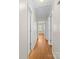 Bright hallway with white trim, neutral walls and hardwood floors, connecting various rooms at 1830 Huntington Pl, Rock Hill, SC 29732