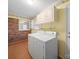 Functional laundry room with a washer, dryer, and overhead cabinetry at 1830 Huntington Pl, Rock Hill, SC 29732