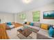 Bright living room with hardwood floors, large windows, and a comfortable seating area at 1830 Huntington Pl, Rock Hill, SC 29732