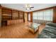 Cozy living room with wood paneling, built-in shelving, and a comfortable couch at 1830 Huntington Pl, Rock Hill, SC 29732
