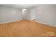 Spacious living room with neutral walls, hardwood floors, and ample natural light at 1830 Huntington Pl, Rock Hill, SC 29732