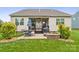 Backyard with patio, fire pit, and lush lawn offers an outdoor living and entertainment space at 2112 Balting Glass Dr, Indian Trail, NC 28079