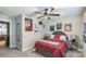 Sports themed bedroom with red bedding, multiple posters, and ceiling fan at 2112 Balting Glass Dr, Indian Trail, NC 28079