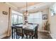 Dining room with a large window and dark wood furnishings, perfect for gatherings at 2112 Balting Glass Dr, Indian Trail, NC 28079
