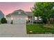 Charming home featuring a well-manicured lawn, stone accents, and a two-car garage, perfect for modern living at 2112 Balting Glass Dr, Indian Trail, NC 28079