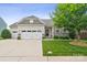 Charming single-Gathering home featuring a stone facade, two-car garage, and well-maintained landscaping at 2112 Balting Glass Dr, Indian Trail, NC 28079
