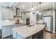 Modern kitchen featuring stainless steel appliances, granite countertops, and a central island at 2112 Balting Glass Dr, Indian Trail, NC 28079