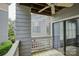 Balcony view with another unit, lush greenery, and sliding glass door to living room at 226 Queens Rd # 68, Charlotte, NC 28204