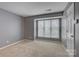 Neutral bedroom with a large window, carpet, and fresh paint provides a calm and inviting atmosphere at 226 Queens Rd # 68, Charlotte, NC 28204