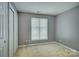 Bright bedroom featuring fresh paint, large window, and a closet, creating a cozy and inviting space at 226 Queens Rd # 68, Charlotte, NC 28204