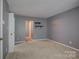 Comfortable bedroom with neutral carpet, offering a serene space with access to closet and bathroom at 226 Queens Rd # 68, Charlotte, NC 28204