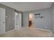 Inviting bedroom with neutral carpet and access to a bathroom, offering comfort and functionality at 226 Queens Rd # 68, Charlotte, NC 28204