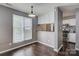 Bright dining area with hardwood floors and a large window near an updated kitchen at 226 Queens Rd # 68, Charlotte, NC 28204