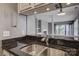 Open kitchen concept, offering a view of the living room with a fireplace and balcony at 226 Queens Rd # 68, Charlotte, NC 28204