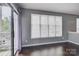 Bright living room with hardwood floors, large windows, and access to the balcony at 226 Queens Rd # 68, Charlotte, NC 28204