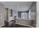 Stylish living room featuring hardwood floors, fireplace, and access to an outdoor balcony at 226 Queens Rd # 68, Charlotte, NC 28204
